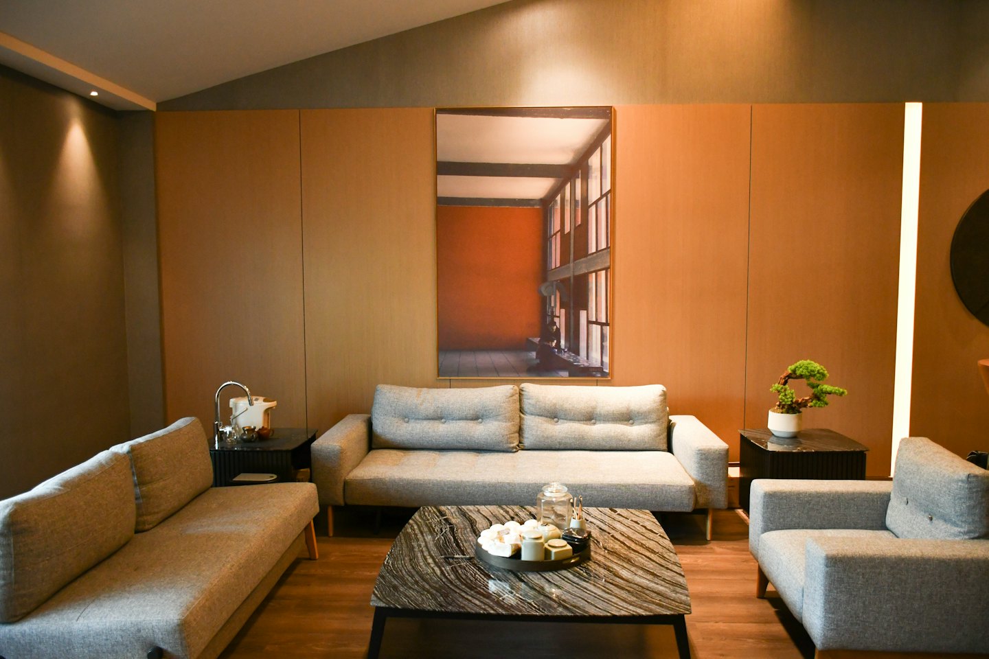 Modern lounge area with sofas arranged around a coffee table.